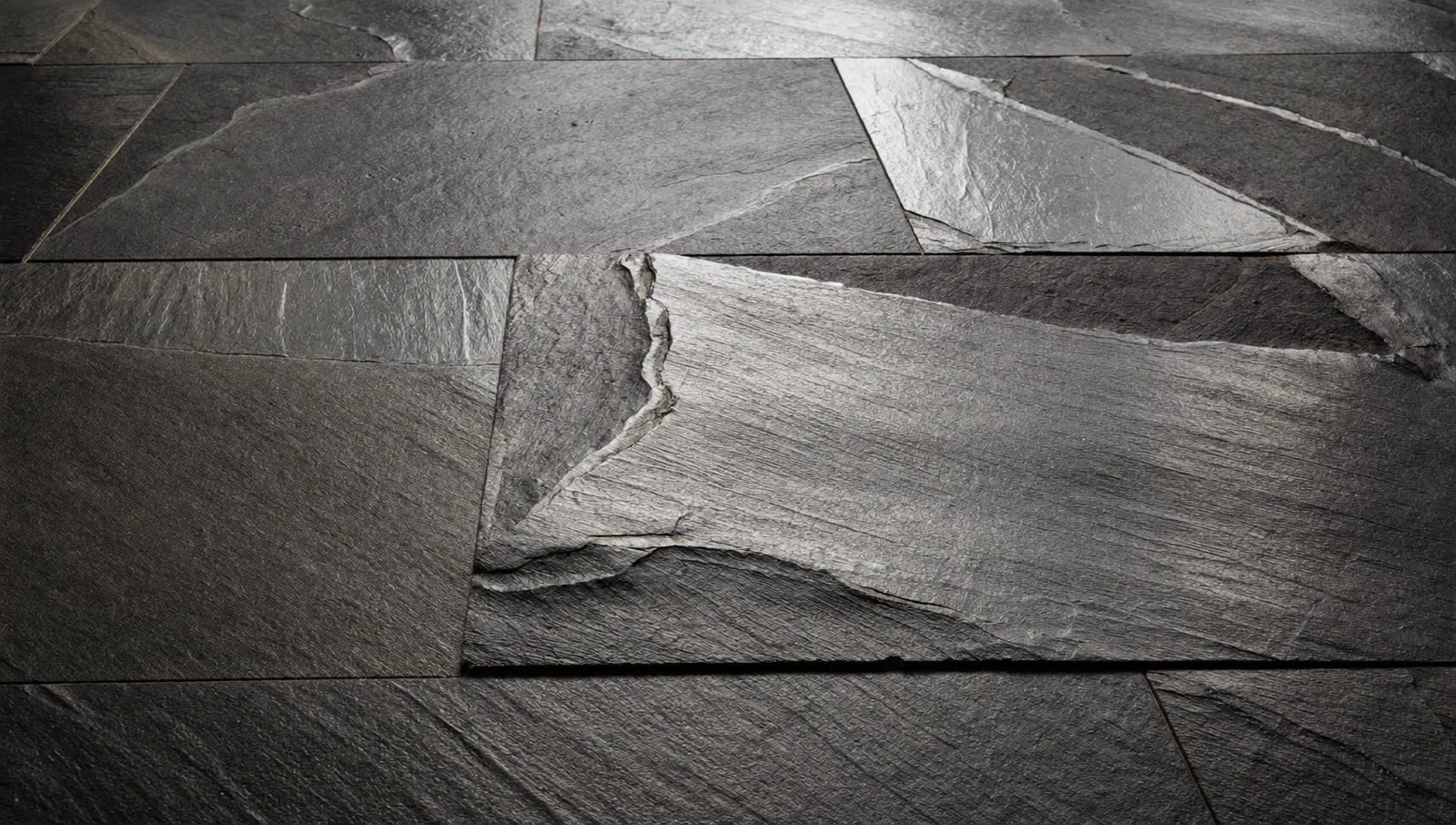 Close-up of natural riven slate texture before specialist cleaning
