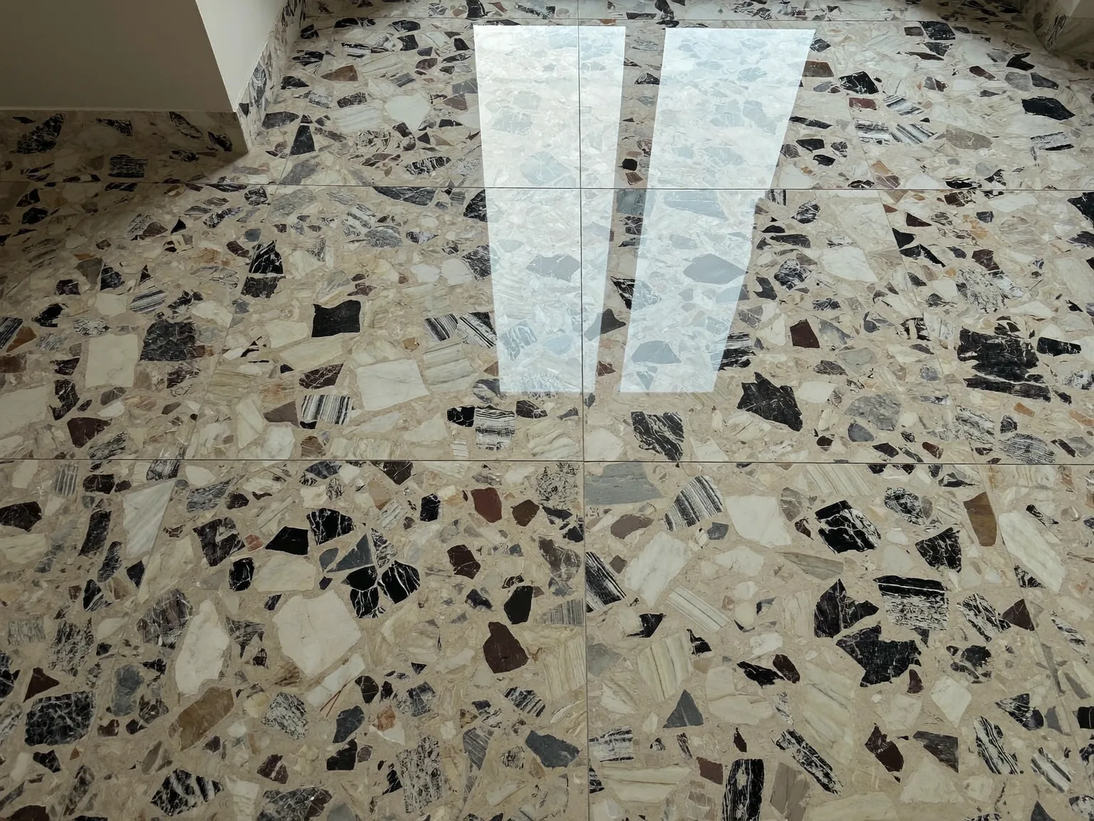 Terrazzo floor restored to a high-gloss mirror finish after professional diamond polishing and sealing in London