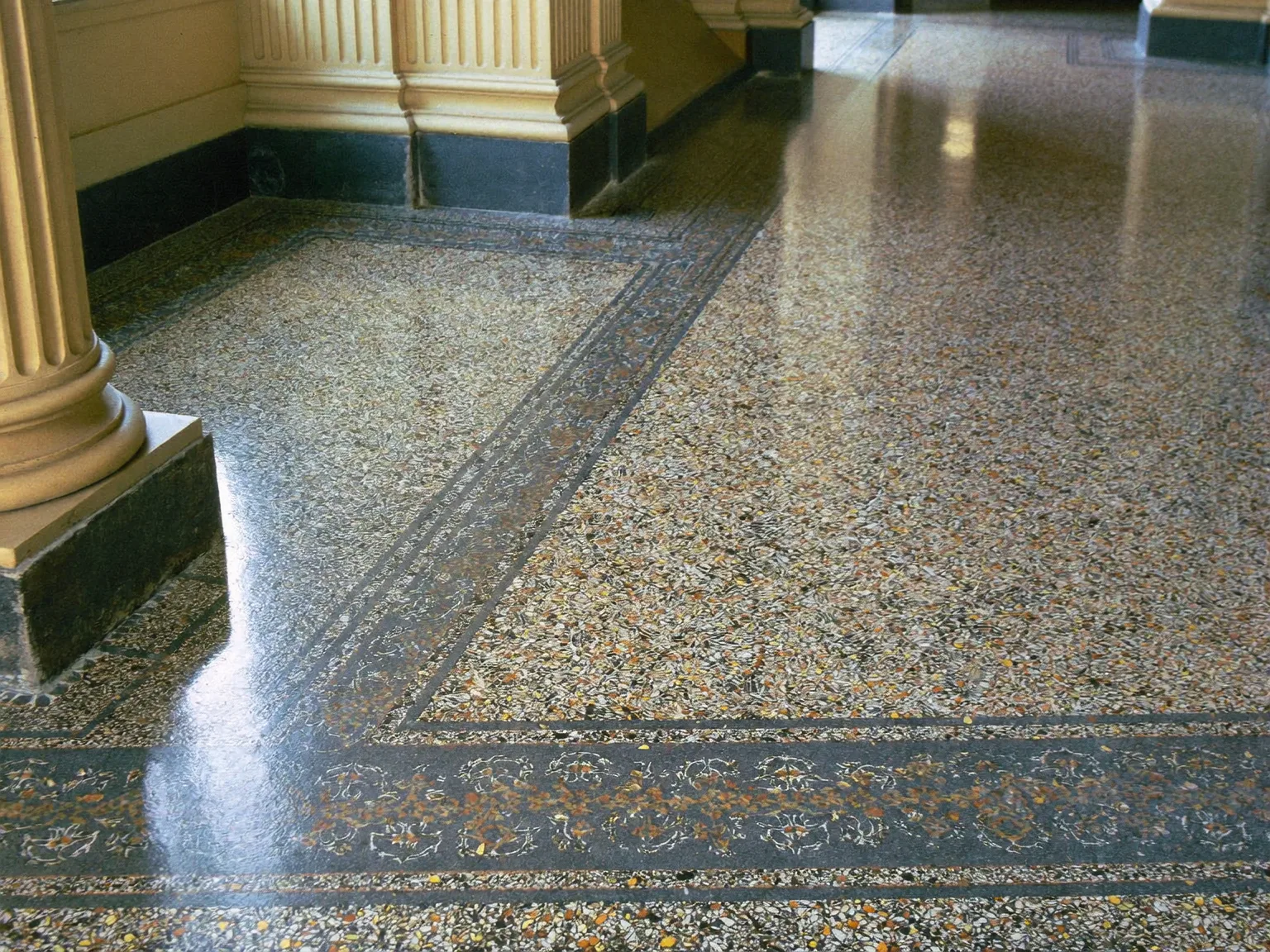 Restored terrazzo floor with decorative border in a listed London heritage building