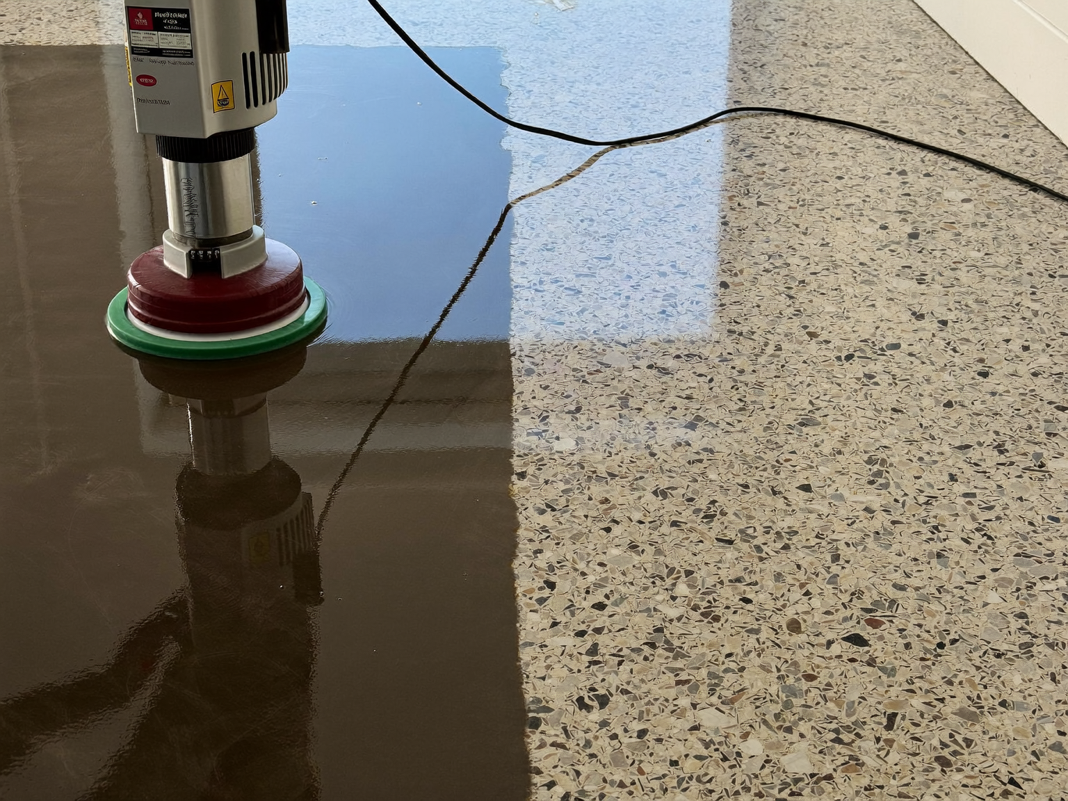 Professional diamond polishing machine restoring a terrazzo floor in London