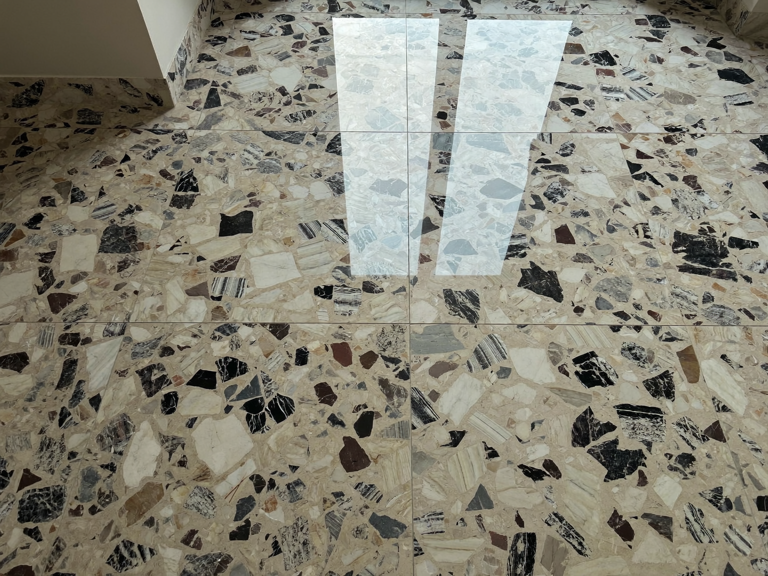 Terrazzo floor restored to a high-gloss mirror finish after professional diamond polishing and sealing in London